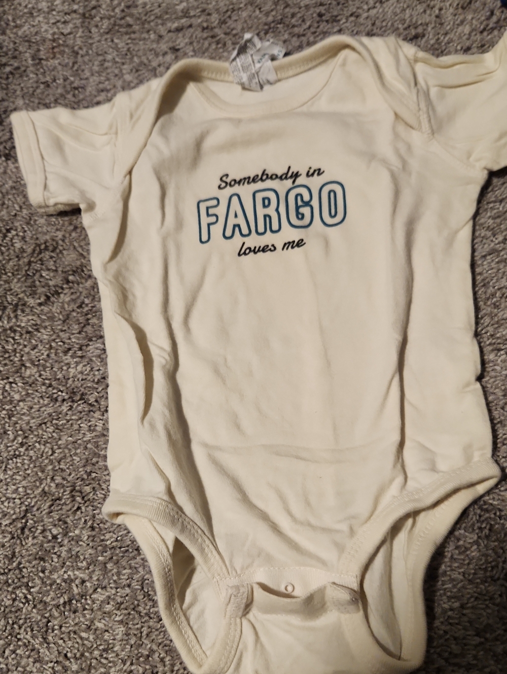 Cream One-Piece Bodysuit with  "Somebody in FARGO Loves Me" Graphic